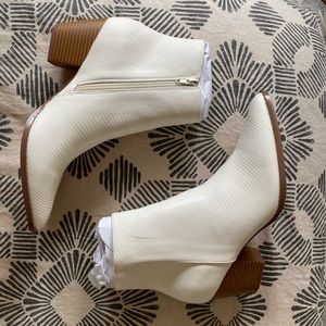 Lulu’s white snakeskin booties